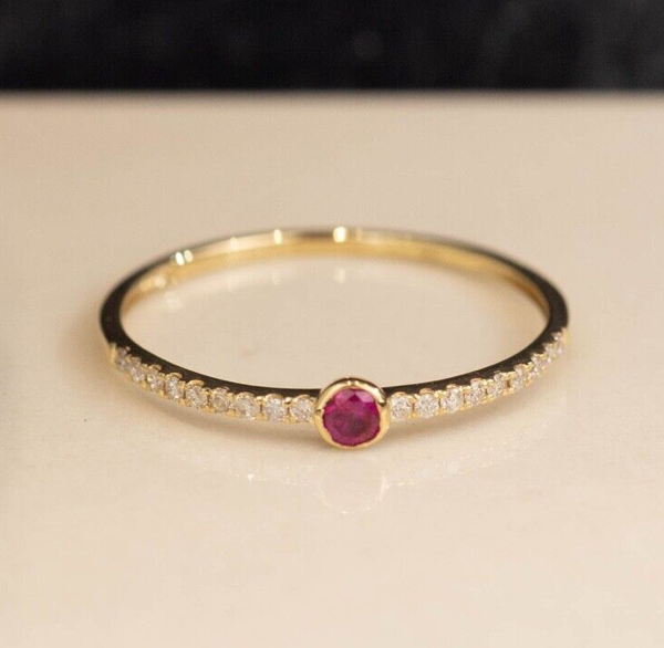 1 pc (approx) .10 Carat Ruby 18 pcs (approx) .0039 Carat Diamonds (SI Clarity; GH Color) 18 Karat Yellow Gold Ring Size: (Cannot Be Resized) Imported Setting (approx) 0.70 Grams Please send a message to get available ring size/s before placing an order.
