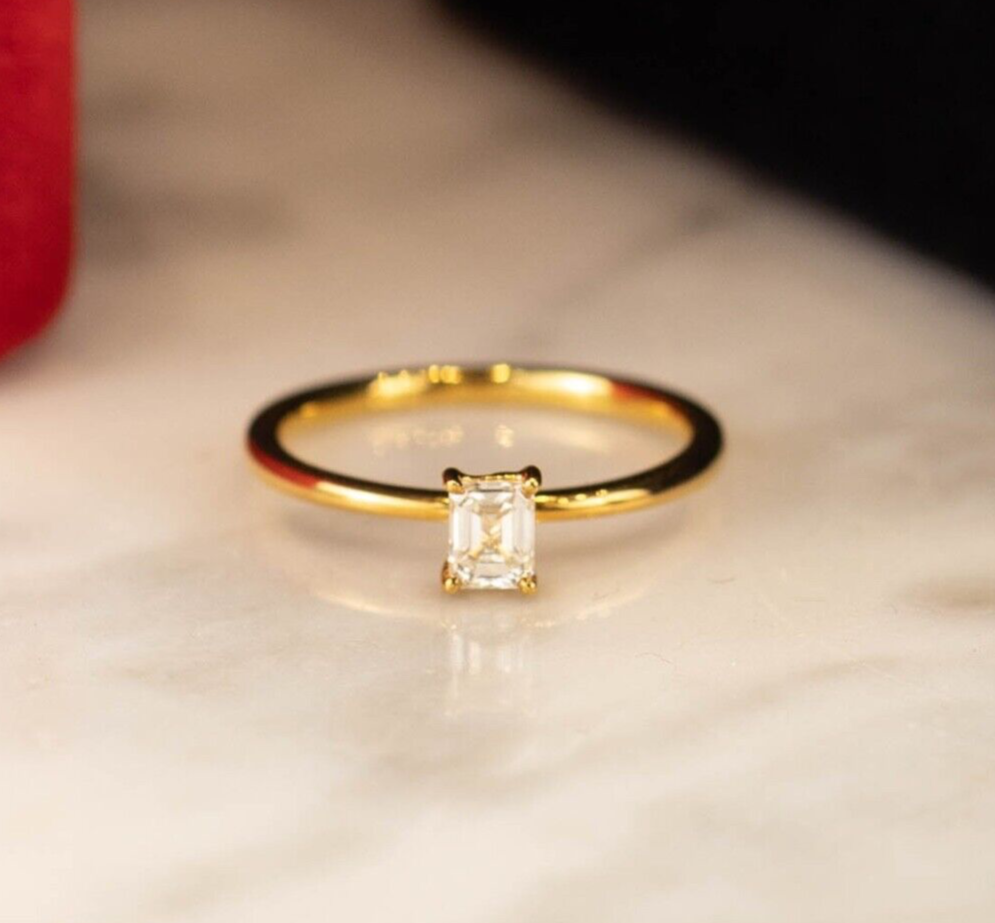 1 pc .34 Carat Emerald Cut Diamond (VS1 Clarity; K Color) 18 Karat Yellow Gold Ring Size: 5.5 (Can be resized 2 size bigger and 2 size smaller) 1.95 Grams CENTER STONE: P38,400 NOTE: Free one time resizing to a smaller size. Minimal charges will be applied for resizing to a bigger size. GIA-Certified .34 Carat Diamond Engagement Ring 18k Yellow Gold ER956